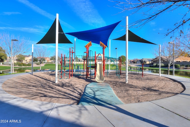 view of playground featuring a water view