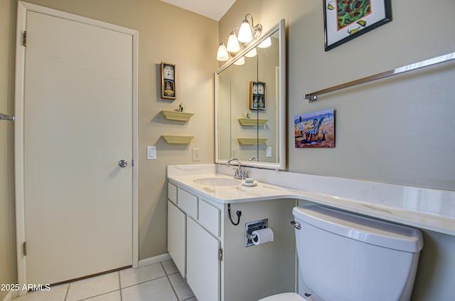 half bathroom featuring toilet, tile patterned flooring, and vanity