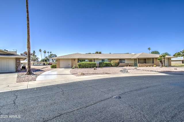 view of front facade with a garage and concrete driveway