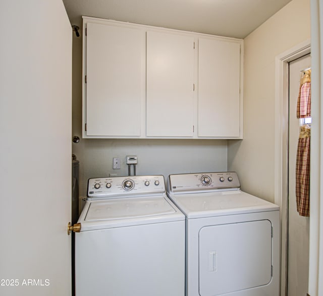 laundry area featuring cabinet space and washer and dryer