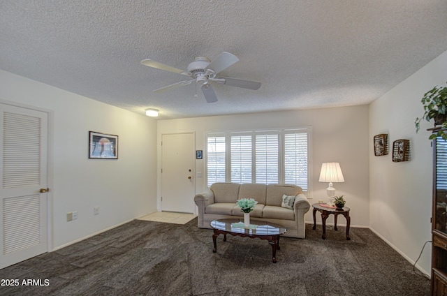 living area with carpet flooring, ceiling fan, and a textured ceiling