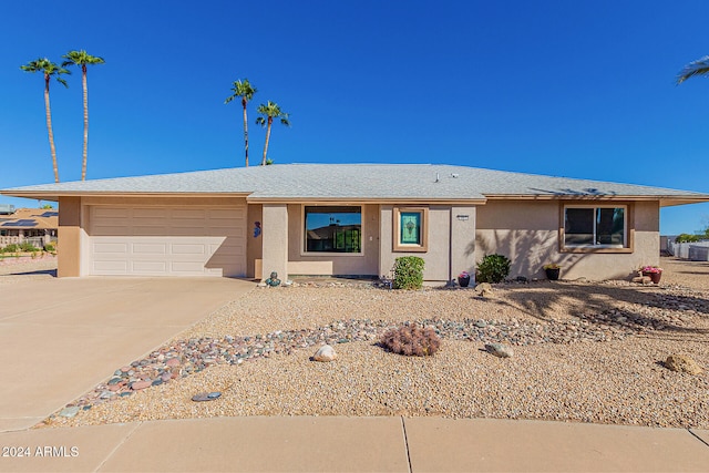 single story home featuring a garage