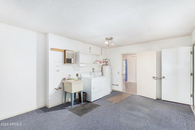 laundry room with a textured ceiling, washer and clothes dryer, and dark carpet