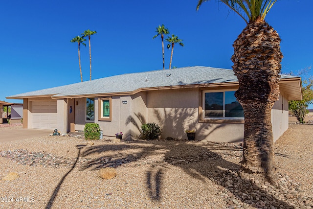 single story home featuring a garage