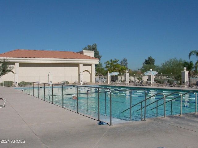 view of swimming pool with a patio area