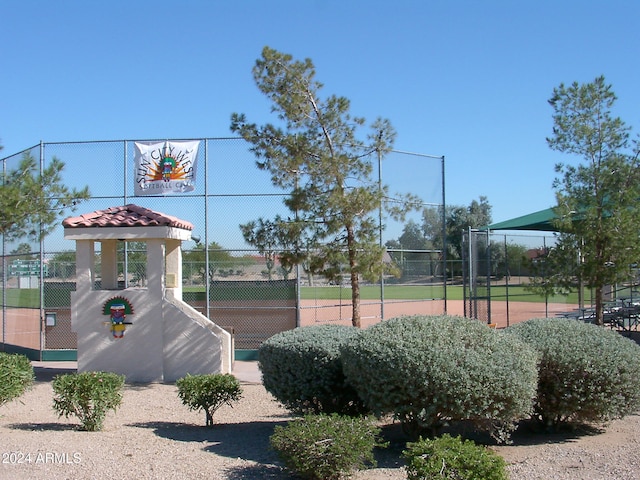 view of property's community with basketball hoop