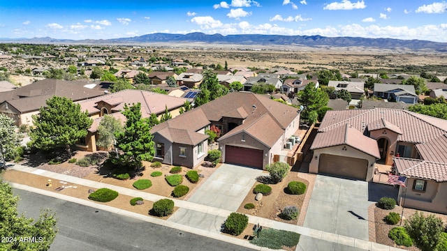 birds eye view of property with a mountain view