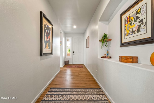 hallway featuring wood-type flooring