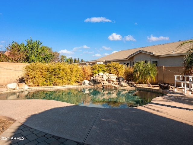 view of pool featuring a patio area