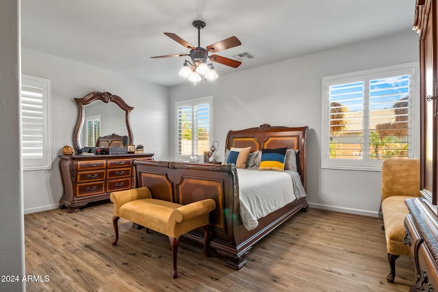 bedroom featuring ceiling fan and light hardwood / wood-style flooring