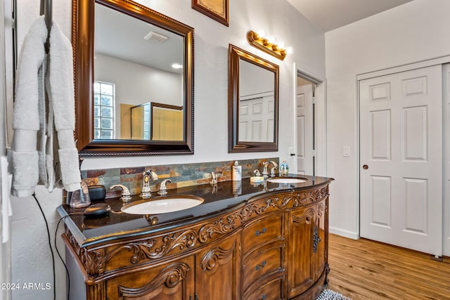 bathroom featuring vanity and hardwood / wood-style flooring