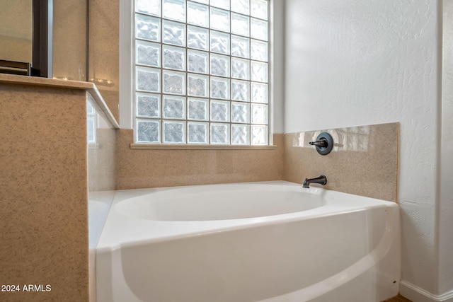 bathroom featuring a tub to relax in