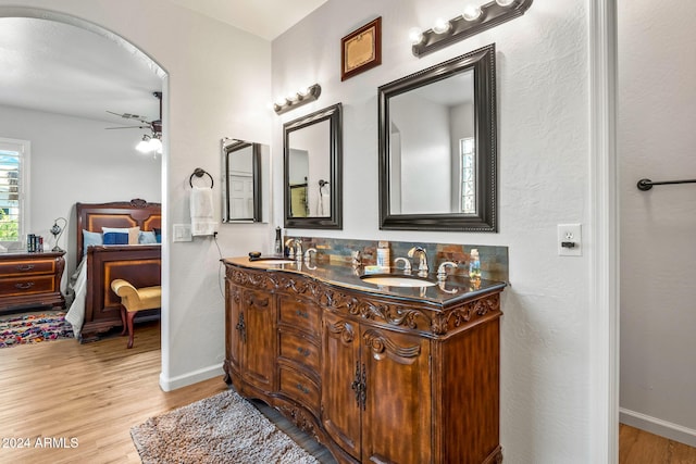 bathroom featuring hardwood / wood-style floors, ceiling fan, and vanity