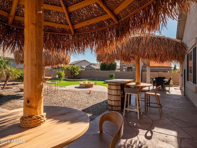 view of patio with a gazebo and a bar