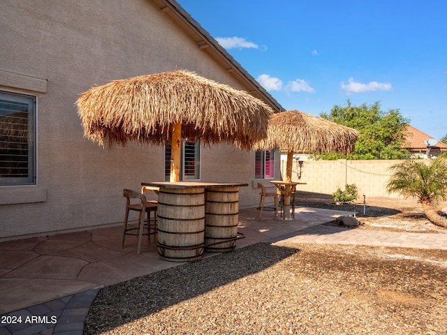 view of patio with exterior bar