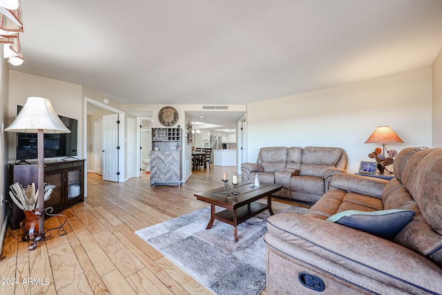 living room with light hardwood / wood-style flooring