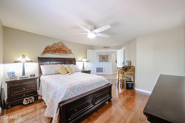 bedroom with ceiling fan and light hardwood / wood-style flooring