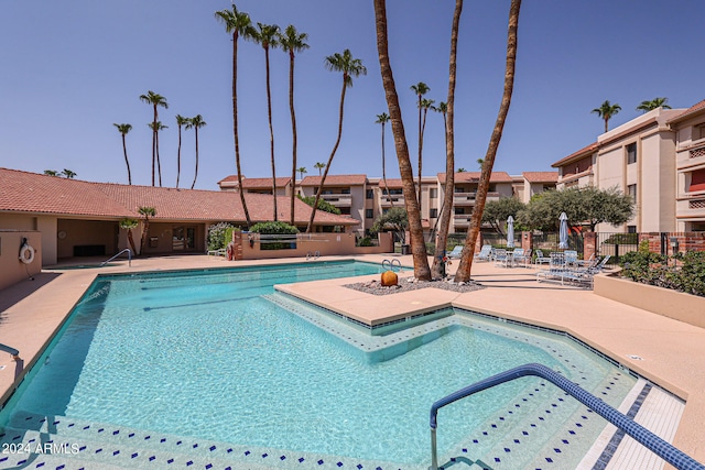 view of swimming pool featuring a patio area