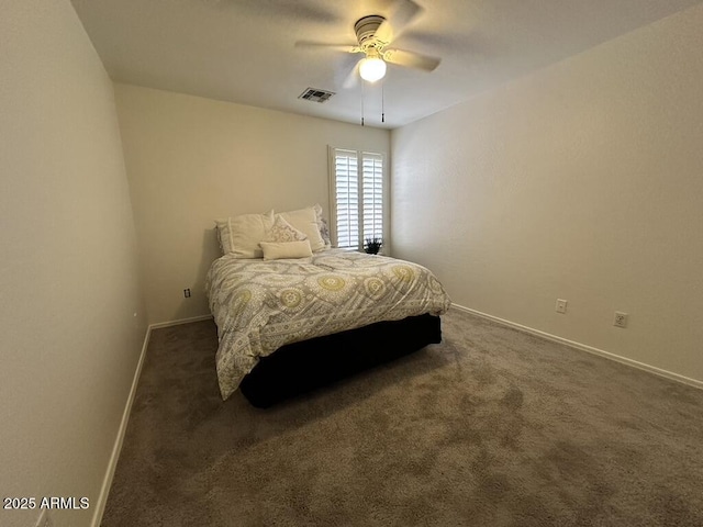 bedroom with baseboards, dark carpet, and ceiling fan
