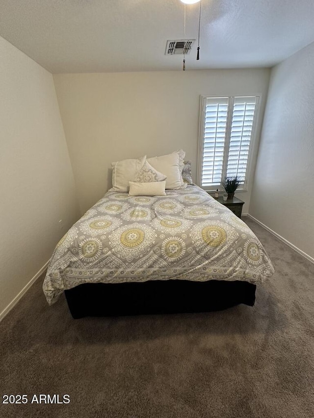 carpeted bedroom featuring baseboards