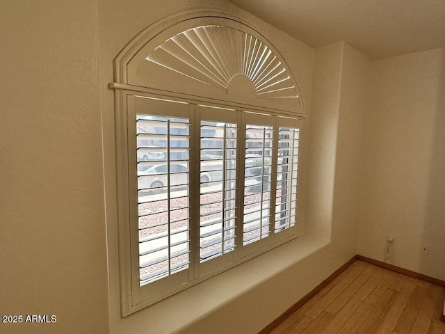 detailed view of wood finished floors and baseboards