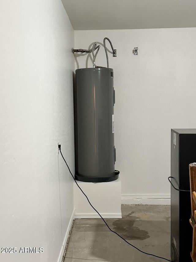 utility room featuring electric water heater