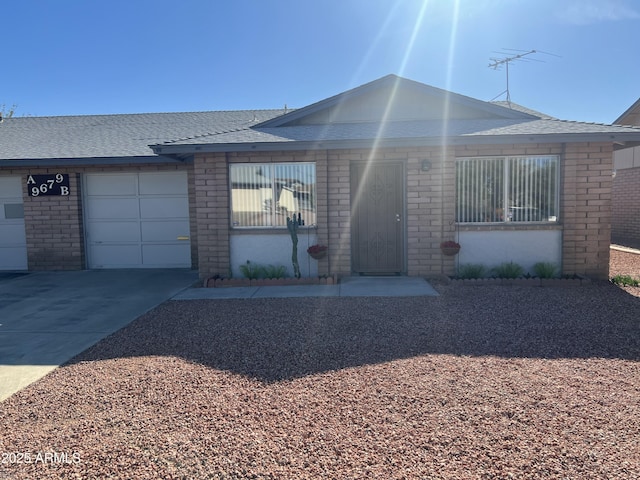 9679 W Cinnabar Ave Unit B, Peoria, AZ 85345 - single story home featuring a shingled roof, brick siding, driveway, and an attached garage