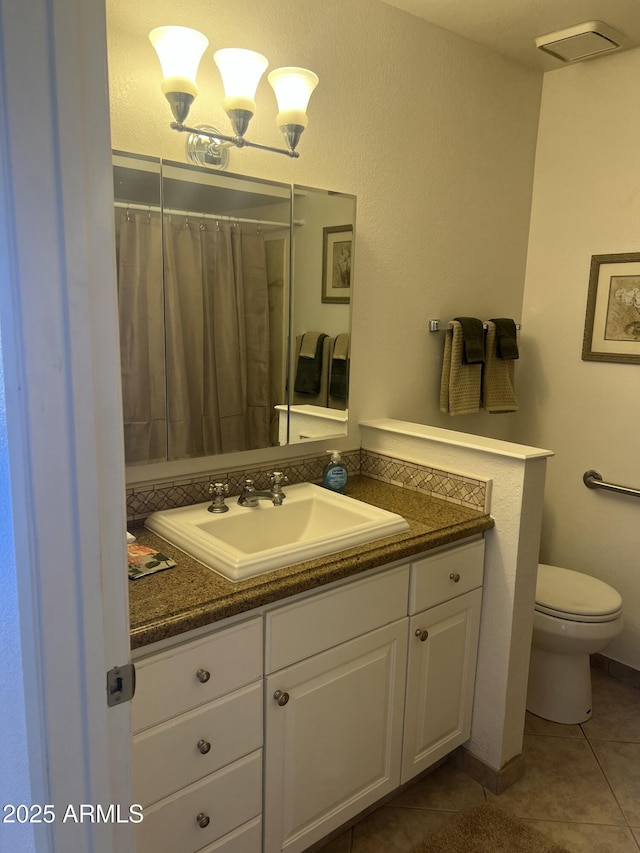 9679 W Cinnabar Ave Unit B, Peoria, AZ 85345 - full bath featuring toilet, tile patterned flooring, and vanity