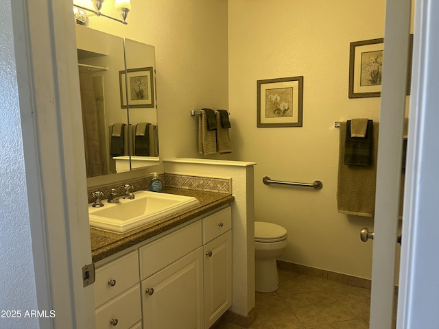 9679 W Cinnabar Ave Unit B, Peoria, AZ 85345 - full bathroom featuring tile patterned floors, toilet, and vanity
