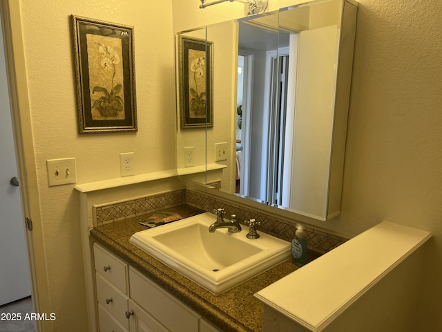 9679 W Cinnabar Ave Unit B, Peoria, AZ 85345 - bathroom with vanity and a textured wall