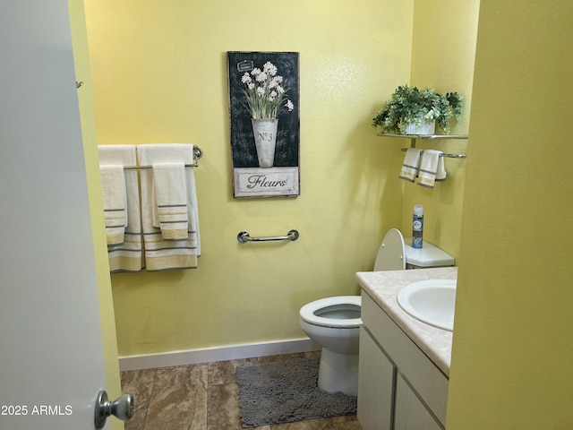 9679 W Cinnabar Ave Unit B, Peoria, AZ 85345 - bathroom with toilet, baseboards, and vanity
