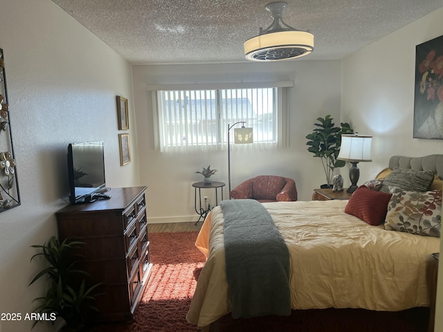 9679 W Cinnabar Ave Unit B, Peoria, AZ 85345 - bedroom with a textured ceiling and wood finished floors
