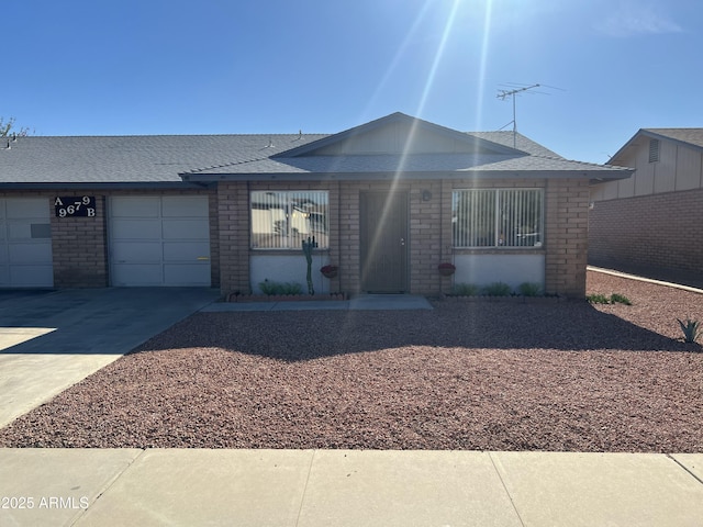 9679 W Cinnabar Ave Unit B, Peoria, AZ 85345 - single story home with driveway, roof with shingles, brick siding, and an attached garage