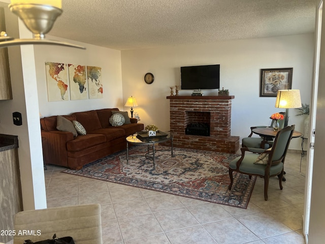 9679 W Cinnabar Ave Unit B, Peoria, AZ 85345 - living room featuring a fireplace, a textured ceiling, and tile patterned floors