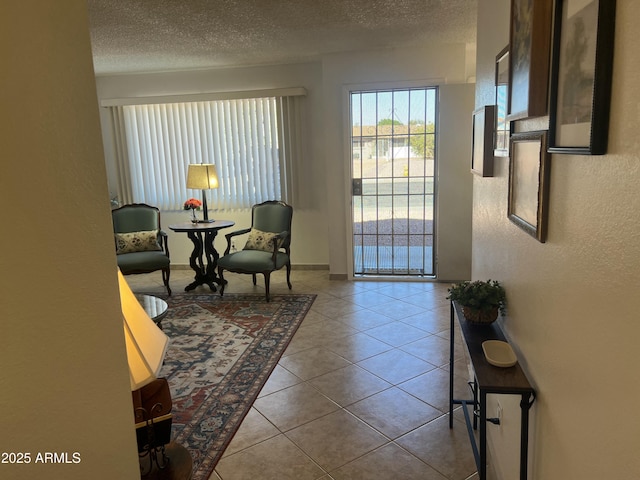 9679 W Cinnabar Ave Unit B, Peoria, AZ 85345 - interior space with tile patterned flooring, a textured ceiling, and a textured wall