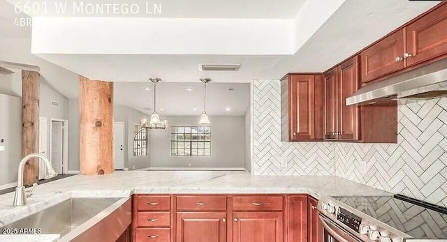 6601 W Montego Ln, Glendale, AZ 85306 - kitchen with stainless steel range with electric stovetop, a sink, under cabinet range hood, decorative backsplash, and light countertops