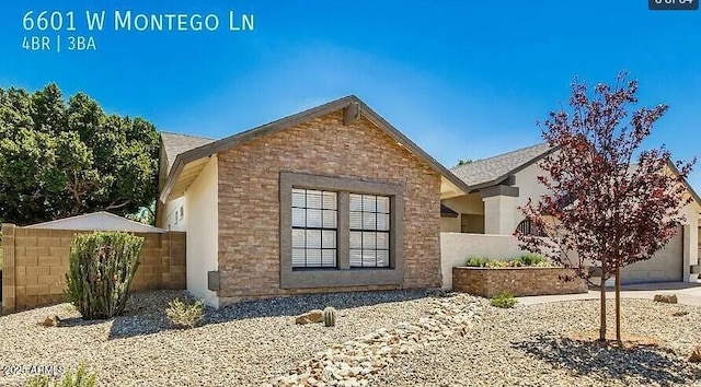 6601 W Montego Ln, Glendale, AZ 85306 - view of home's exterior featuring fence and brick siding