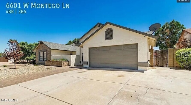 6601 W Montego Ln, Glendale, AZ 85306 - ranch-style house featuring driveway, stucco siding, a garage, and fence