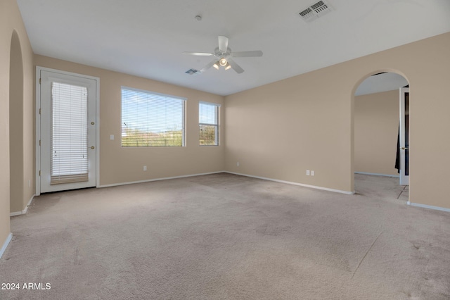 carpeted empty room with ceiling fan