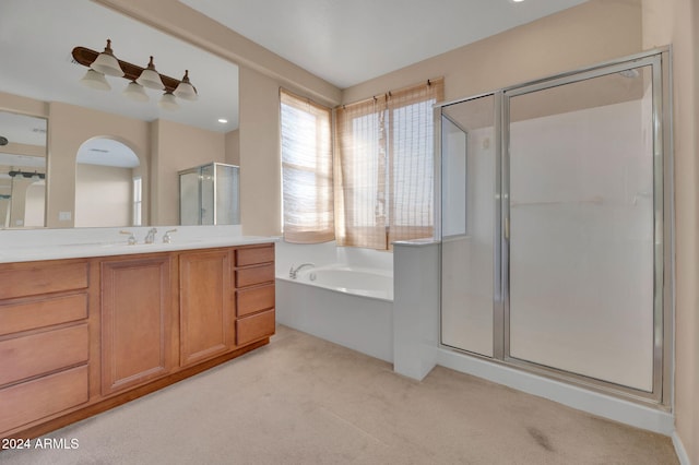 bathroom with vanity and plus walk in shower