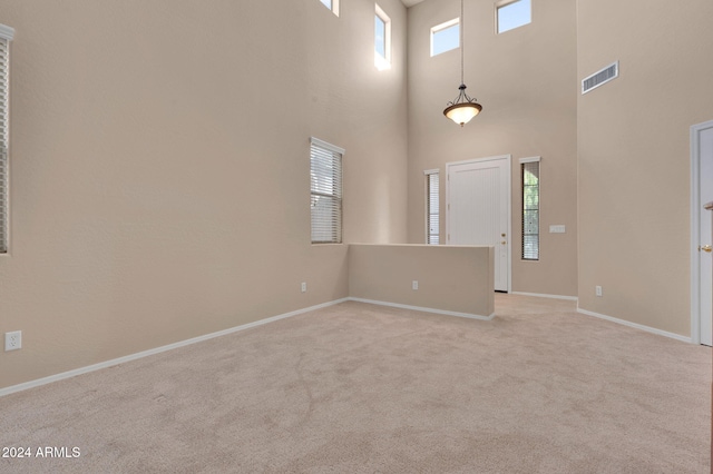 empty room featuring light colored carpet