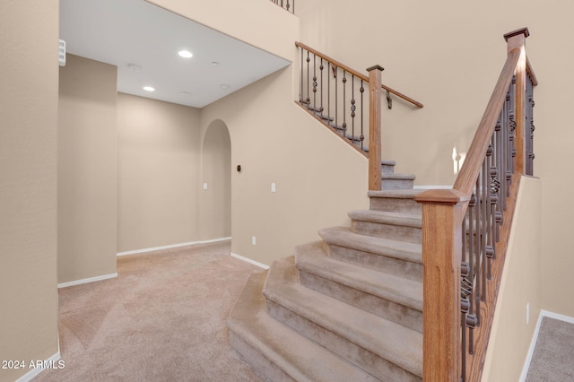 stairs featuring carpet floors