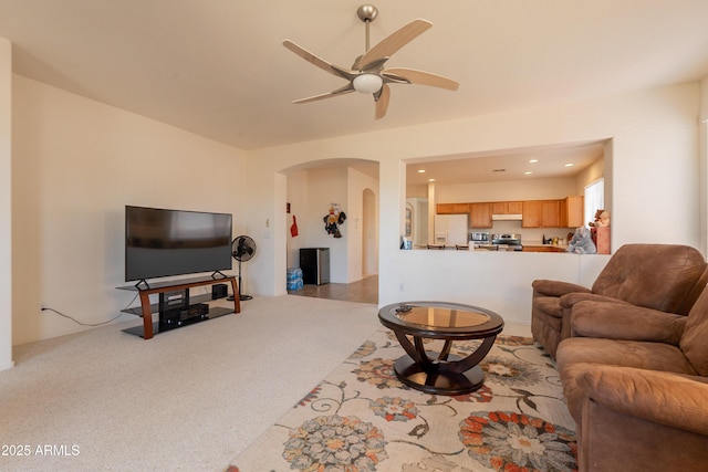 170 E Canary Ct, San Tan Valley, AZ 85143 - living room featuring arched walkways, a ceiling fan, and carpet