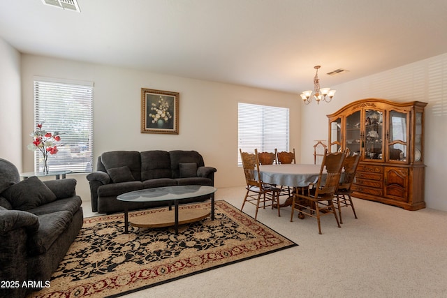 170 E Canary Ct, San Tan Valley, AZ 85143 - carpeted living area featuring a chandelier