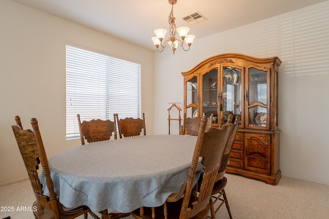 170 E Canary Ct, San Tan Valley, AZ 85143 - carpeted dining area featuring a chandelier