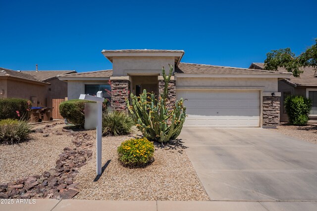 170 E Canary Ct, San Tan Valley, AZ 85143 - prairie-style house with stone siding, stucco siding, an attached garage, and driveway