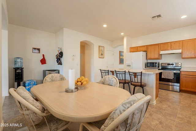 170 E Canary Ct, San Tan Valley, AZ 85143 - dining area with arched walkways and recessed lighting