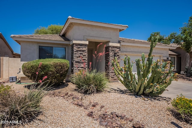 170 E Canary Ct, San Tan Valley, AZ 85143 - view of front of home featuring a garage, stucco siding, and stone siding