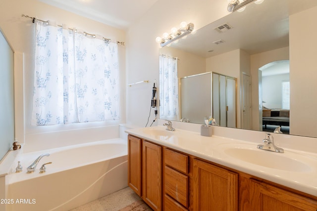 170 E Canary Ct, San Tan Valley, AZ 85143 - ensuite bathroom featuring a shower stall, a bath, and double vanity