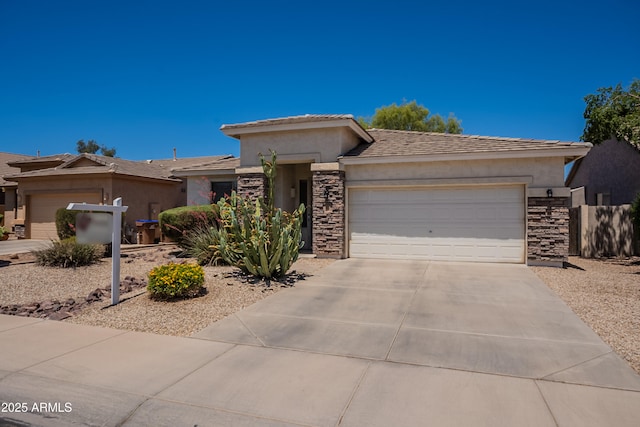 170 E Canary Ct, San Tan Valley, AZ 85143 - view of front of home with stone siding, an attached garage, stucco siding, concrete driveway, and a tile roof